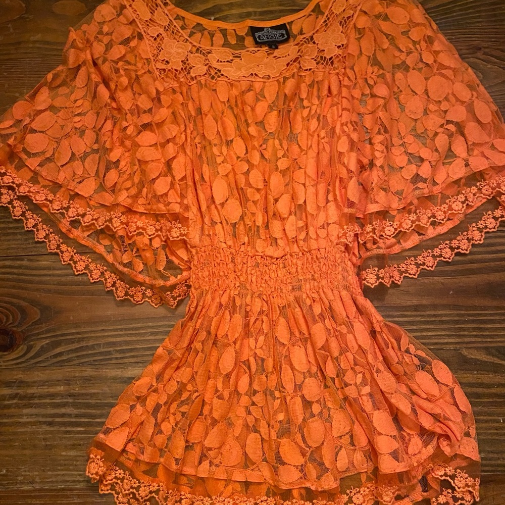 Angie orange lace top. Excellent condition.